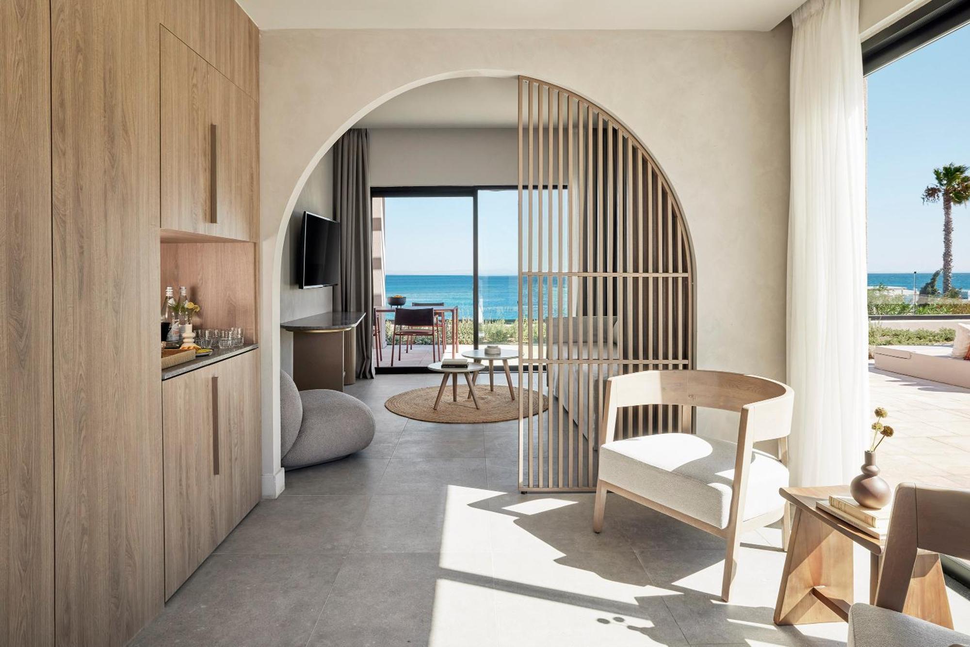 Helea Lifestyle Beach Resort Kallithéa الغرفة الصورة Interior of a suite at the hotel